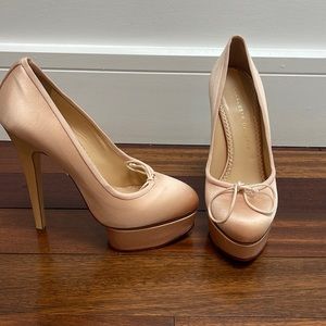 Pre loved and very gently used , pink satin charlotte Olympia pumps.